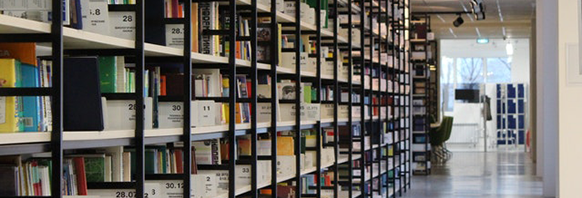 This is the Abstracts, Briefs, and Publications section with an image of shelves mounted to a wall containing hundreds of pamphlets